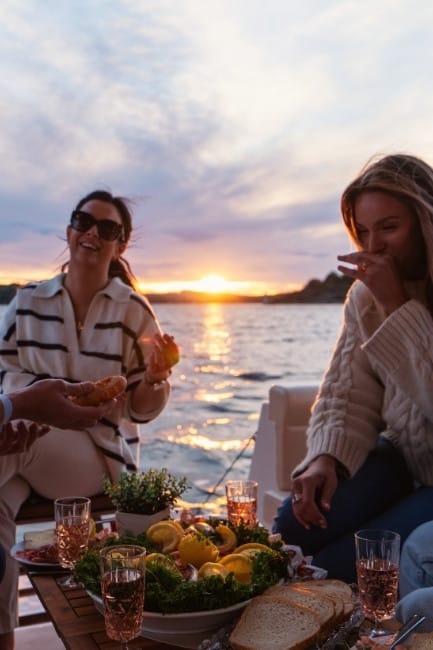 Friends getaway on board electric boat Group of friends enjoys great time on board an electric boat.