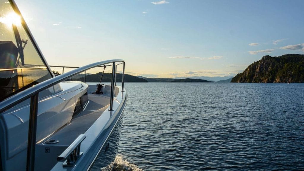 Electric Yacht rental in Telemark An electric yacht sails towards the open sea.